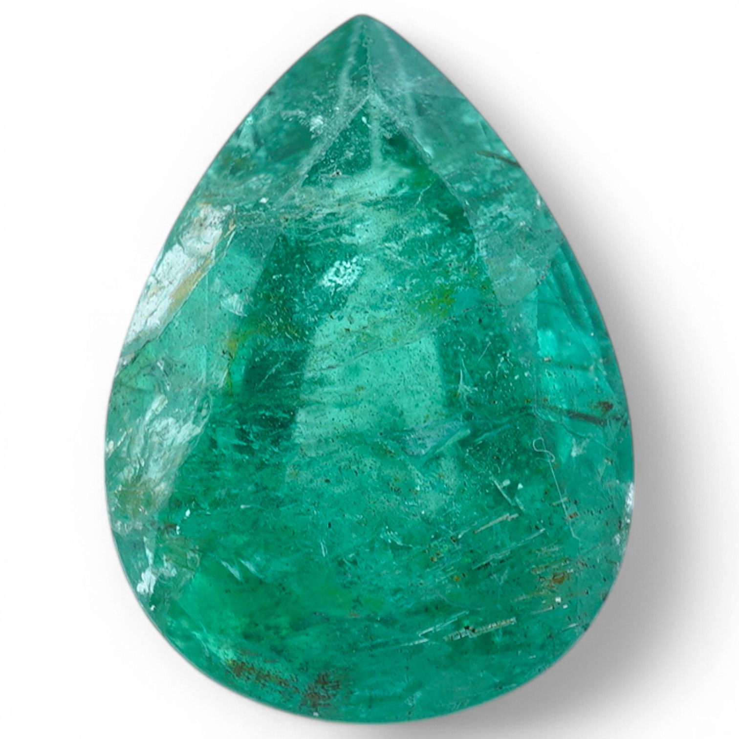 An unmounted pear cut emerald, weighing 6.32ct. Condition - poor to fair